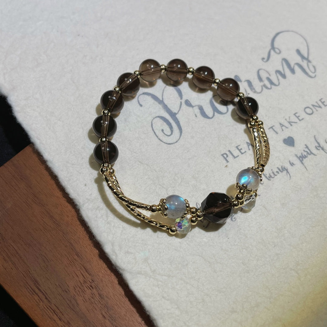 Close-up of smoky obsidian beads with iridescent gray moonstone