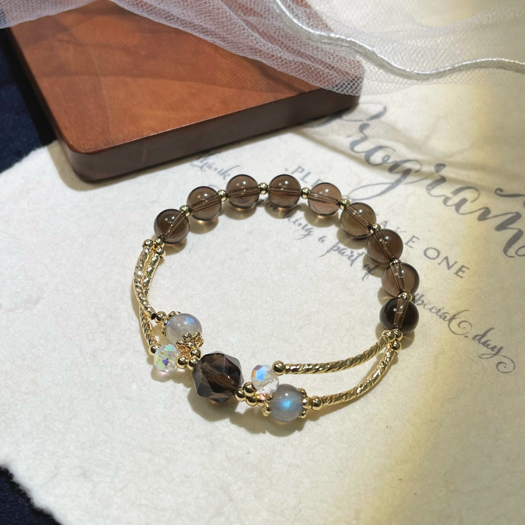 Handmade gemstone bracelet featuring obsidian and moonstone