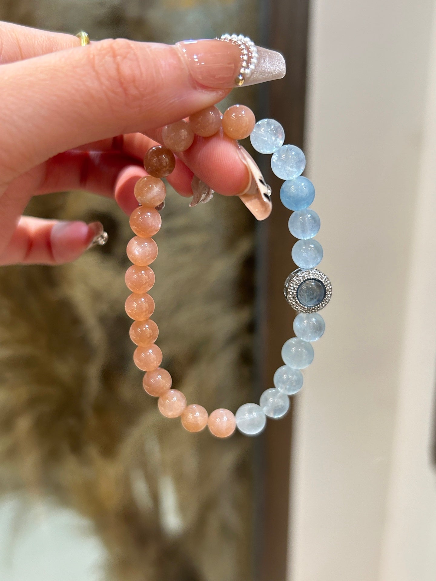 Close-up of orange moonstone and aquamarine healing crystals