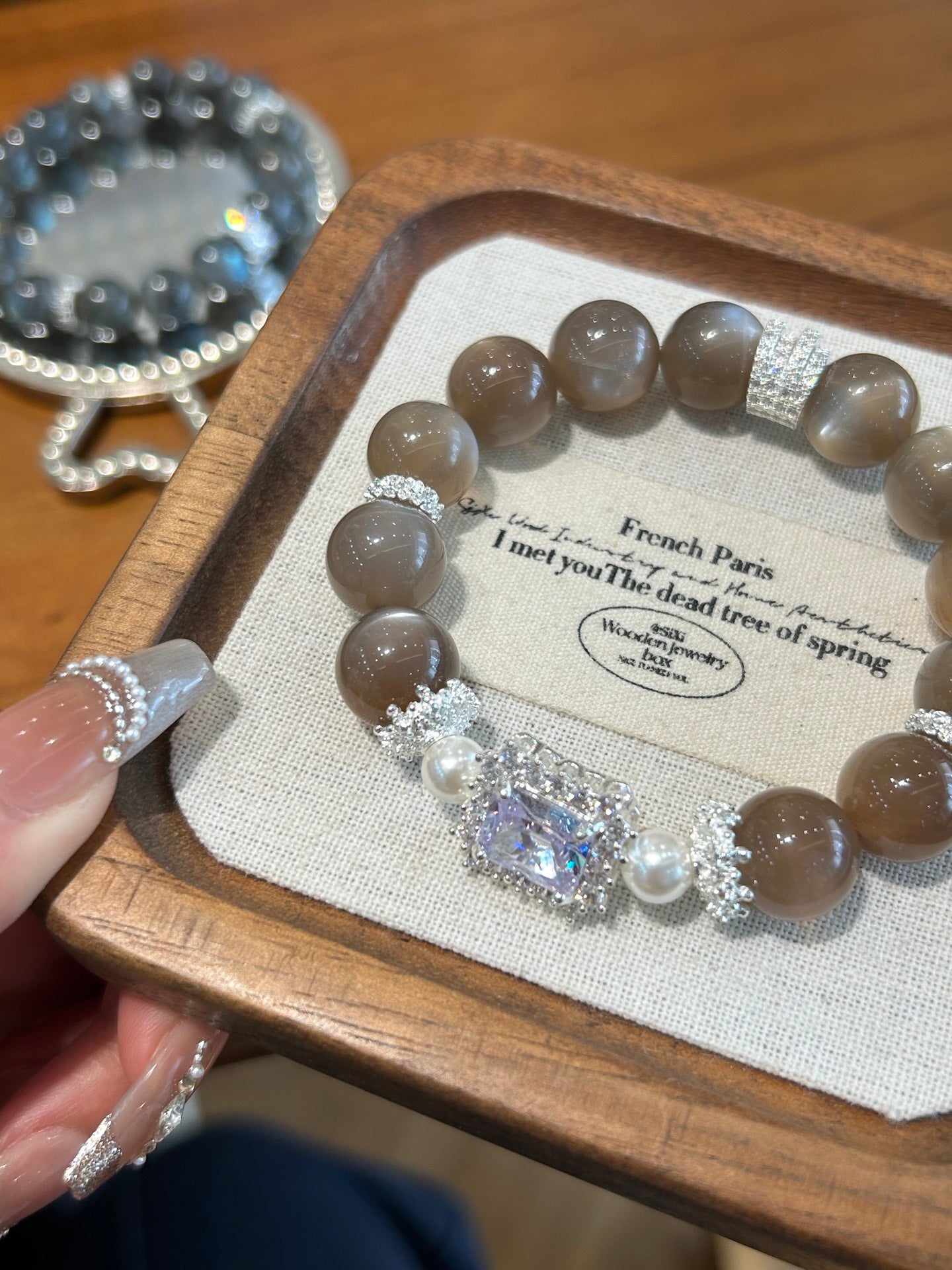 Wearing gray moonstone crystal bracelet for emotional balance