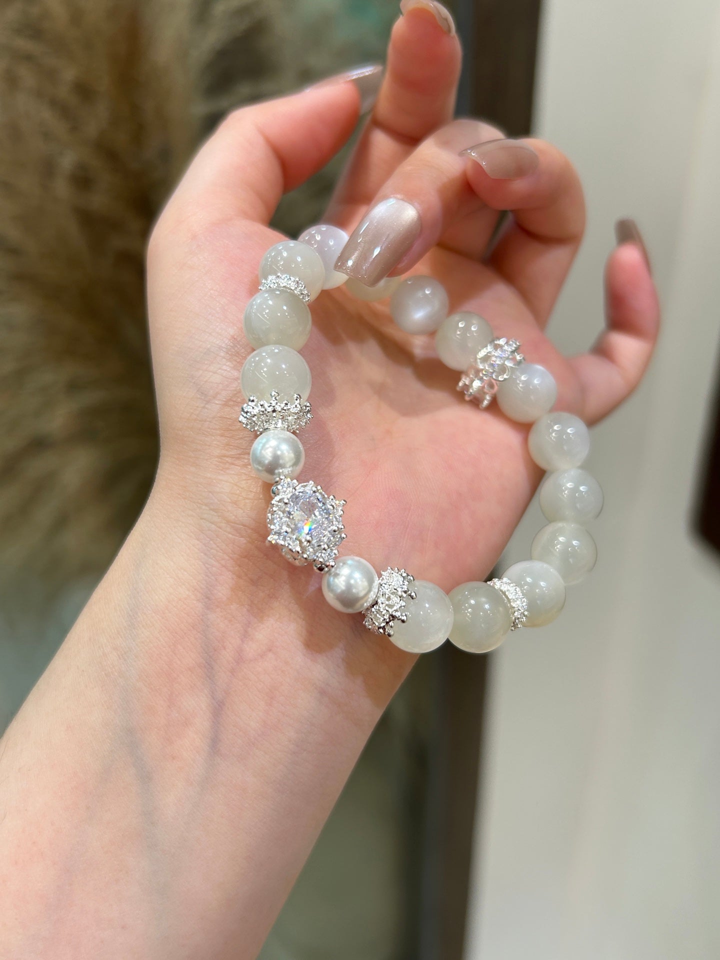 Wearing handmade white moonstone crystal bracelet for women