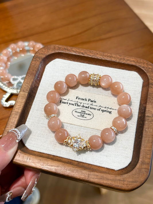 Gift box presentation of peach moonstone bracelet, perfect for good luck and spiritual renewal