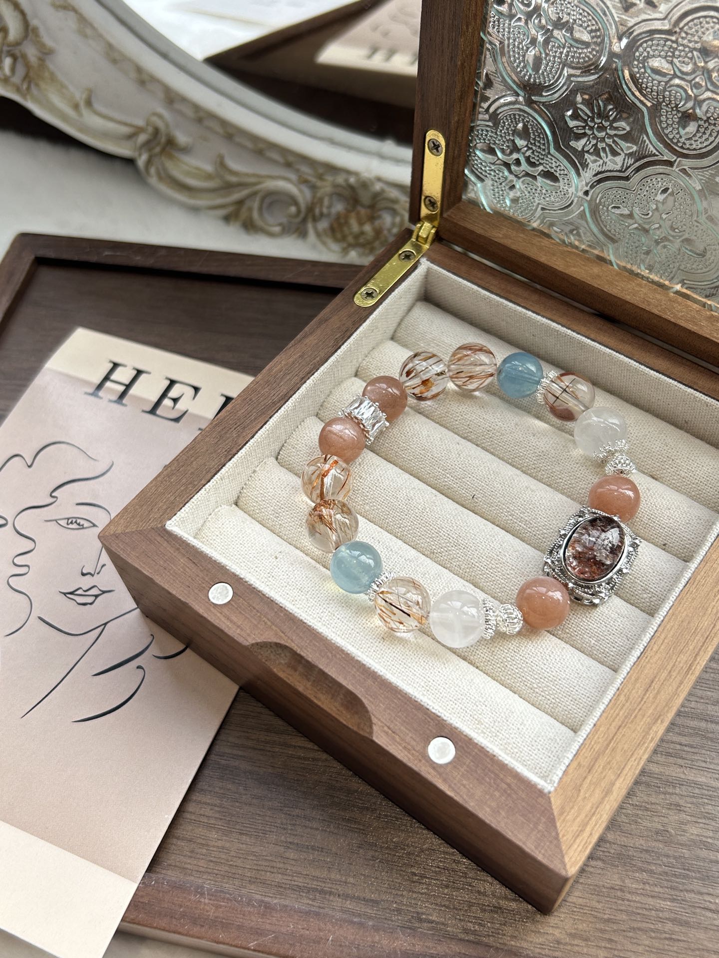 Crystal bracelet in a wood box, featuring aquamarine, phantom quartz, black rutile, and peach moonstone—designed for luck, clarity, and energy balance.