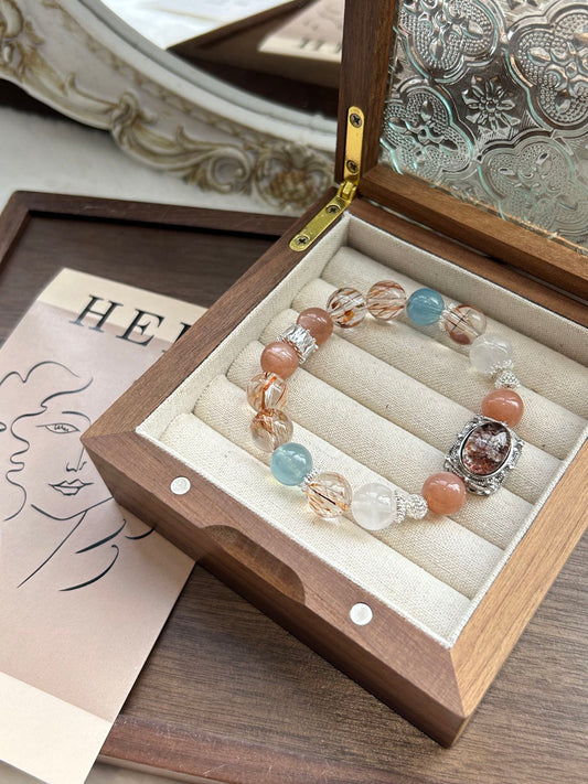 Crystal bracelet in a wood box, featuring aquamarine, phantom quartz, black rutile, and peach moonstone—designed for luck, clarity, and energy balance.