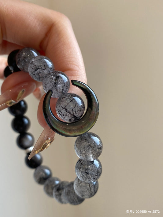 Black rutilated quartz and silver obsidian bracelet with crescent moon charm – designed for protection, intuition, and emotional balance.